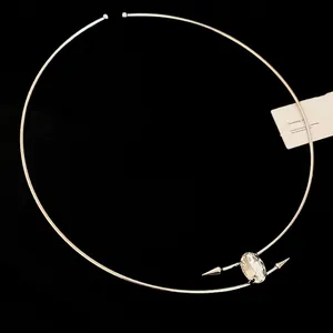 Minimalist silver choker necklace with oval crystal stone and tapered metallic points