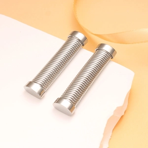 Detail shot of silver stainless steel cylindrical earrings with spiral thread texture
