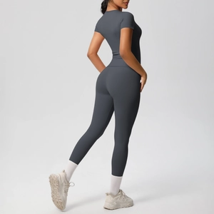 Detail view of charcoal grey high-waist yoga pants and athletic t-shirt set for women