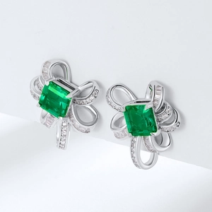 Elegant S925 silver stud earrings with emerald-cut green gemstone and ribbon bow design