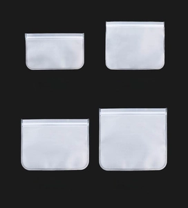 Frosted food storage bags in four sizes with white zipper closures on black background