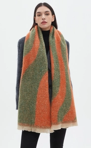 Detail of orange and green striped bouclé scarf with thick woven texture and fringed hem