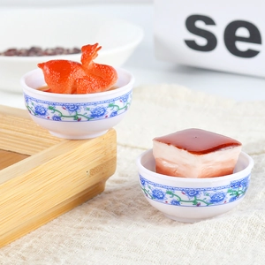 Realistic miniature food models of braised pork and roast duck in blue and white porcelain bowls