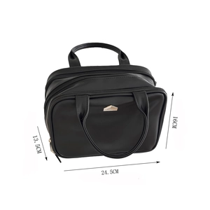 Detailed view of black travel cosmetic bag with dimensions 24.5x16x13.5cm and multi-layers