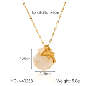 Detailed view of 18K gold starfish and shell pendant necklace with size measurements