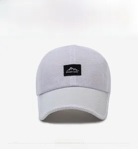 Close-up of white mesh baseball cap with Mount Hood patch and breathable fabric detail