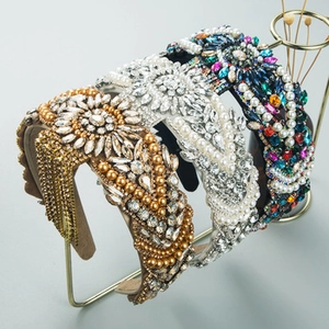 Detailed macro view of four luxury baroque headbands featuring pearls and crystals