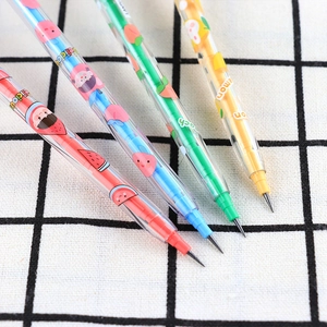 Close-up of four colorful fruit-patterned non-sharpening pencils on checkered fabric