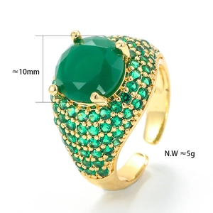 Macro detail of gold-plated hip-hop ring with large green zircon and micro-pave setting
