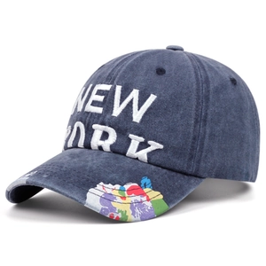 Detail view of washed navy blue baseball cap with white 3D New York embroidery