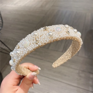 Detail of beaded headband with faux pearls, aurora stones, and non-slip inner lining