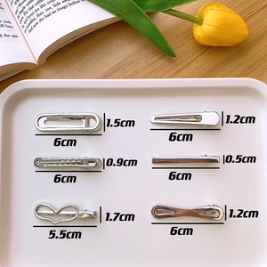 Detailed view of silver metallic Y2K hair clips set with specific size measurements