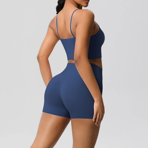 Detail view of navy blue yoga set showing the racerback bra and high-waist fitness shorts