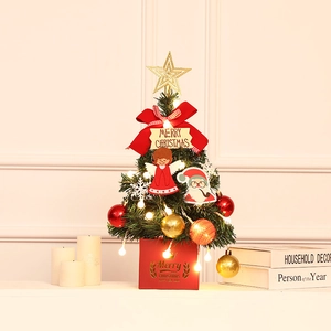 Mini pre-lit Christmas tree with red bows and gold star for festive tabletop decoration