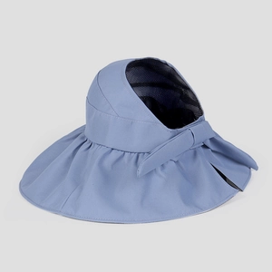 Detailed view of Morandi blue sun hat showing breathable mesh lining and elegant bow