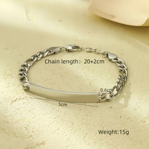 Macro shot of silver minimalist plate bracelet with lobster clasp and adjustable chain