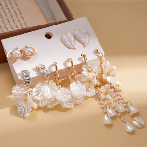 Elegant 10-piece earring set featuring pearls, shell flowers, and tassels on white card