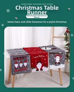 Detail of Christmas table runners with Gnome patterns and Merry Christmas embroidery