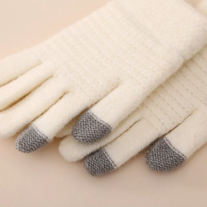 Close-up of knit winter gloves with touchscreen fingertips and warm elastic cuffs