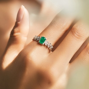 Emerald cut green gemstone ring with vintage leaf design in sterling silver