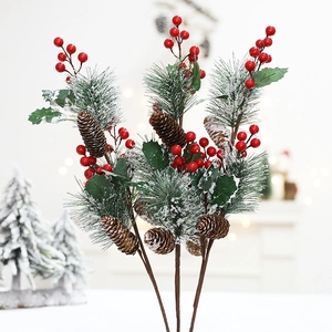 Artificial Christmas cedar branch with red berries and pine cones with faux snow