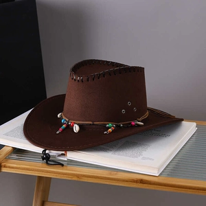 Detail of brown faux suede cowboy hat with colorful beads and shell decorations