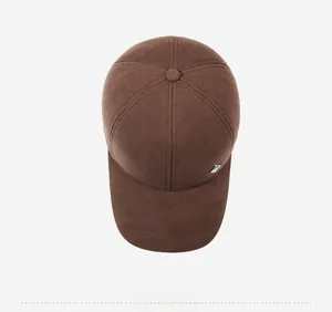 Detailed top view of dark brown wool baseball cap with side metallic logo emblem