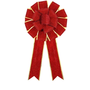 Glittery red Christmas bow with gold edges for holiday tree and home decoration