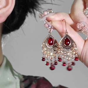 Vintage gold waterdrop earrings with red stones and ethnic hollow floral design