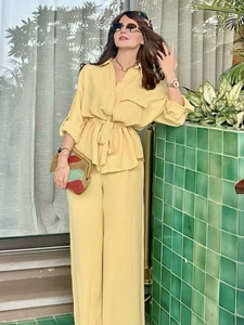 Bright yellow two-piece summer set with drawstring long sleeve shirt and wide leg trousers