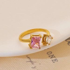 Detail of 18k gold plated open ring with pink rectangle and white heart zircon stones