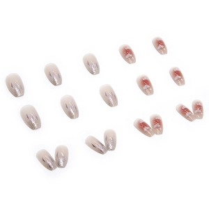 Pink and grey gradient press-on nails with sparkling glitter and white cloud star designs
