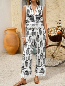 Detail of V-neck sleeveless top with paisley print and matching wide-leg pants