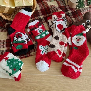 Thick coral fleece Christmas socks featuring festive Santa, reindeer and tree patterns