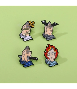 Detailed set of four enamel prayer hand pins with cross, bat wings, dagger and flame motifs