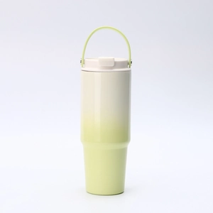 Detail view of 30oz insulated stainless steel tumbler with yellow-white gradient and handle