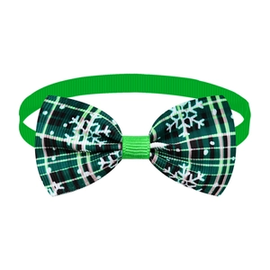 Green plaid pet bowtie with white snowflake print and adjustable elastic strap