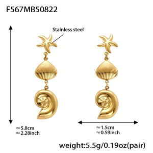 Detailed view of gold starfish and shell earrings with dimensions 5.8cm in length
