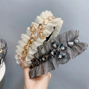 Luxe ruffled headbands with sparkling rhinestones in gold and grey fabric styles