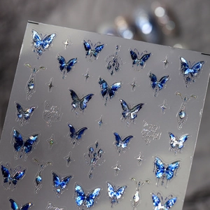 Autocollants à ongles papillons holographiques bleus avec feuille métallique et étoiles