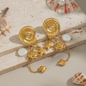 Golden sun and star snail shell tassel earrings with pearls on a natural stone base