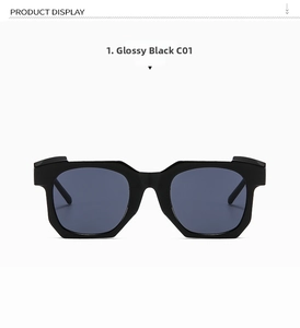 Detailed macro view of glossy black geometric sunglasses frame and dark grey UV lenses