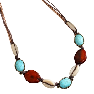 Detail of bohemian waist chain with turquoise beads, brown gems and shell accents