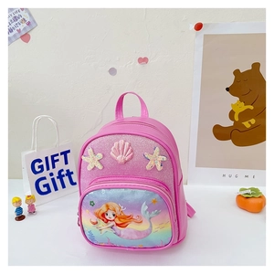 Detail of pink mermaid princess backpack with glitter finish and seashell accessories