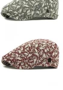 Detail of vintage textured newsboy caps in gray and burgundy with side buckle