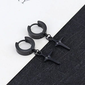 Pair of polished black stainless steel huggie hoop earrings with star-shaped pendants