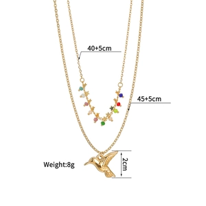 Detailed view of layered bird necklace with size specs, 40+5cm length and 2cm hummingbird