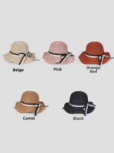 Detail view of five summer straw sun hats with elegant bow ribbons in multiple colors