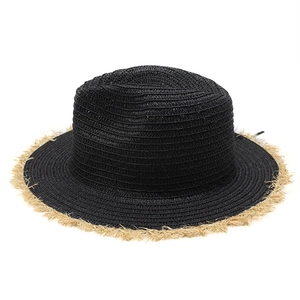 Detailed texture of black woven straw sun hat featuring elegant beige frayed fringe edge