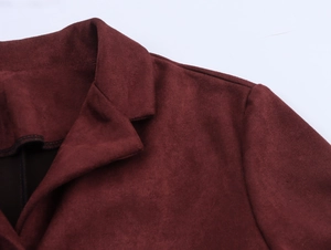 Detailed view of burgundy faux suede jacket featuring lapel collar and soft texture